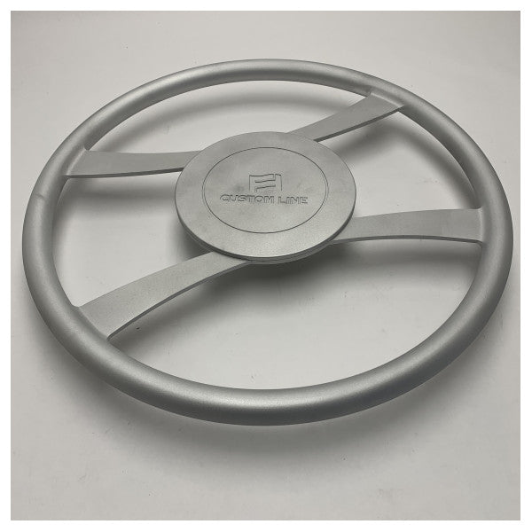 The Custom Line 550 mm FFCL120 is an anodized steering wheel with a logo.